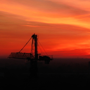 A skyline construction site at sunset