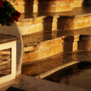 Golden sunlight on the steps of a fountain
